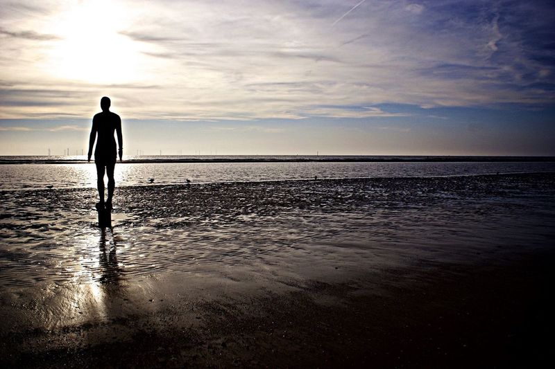 Silhouette of man standing on beach