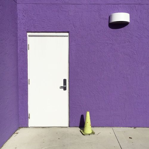 Purple wall with closed door
