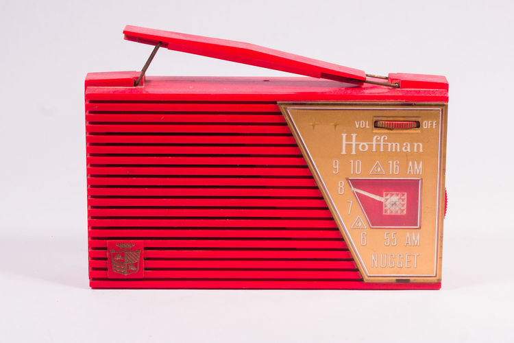 Low angle view of red transistor radio