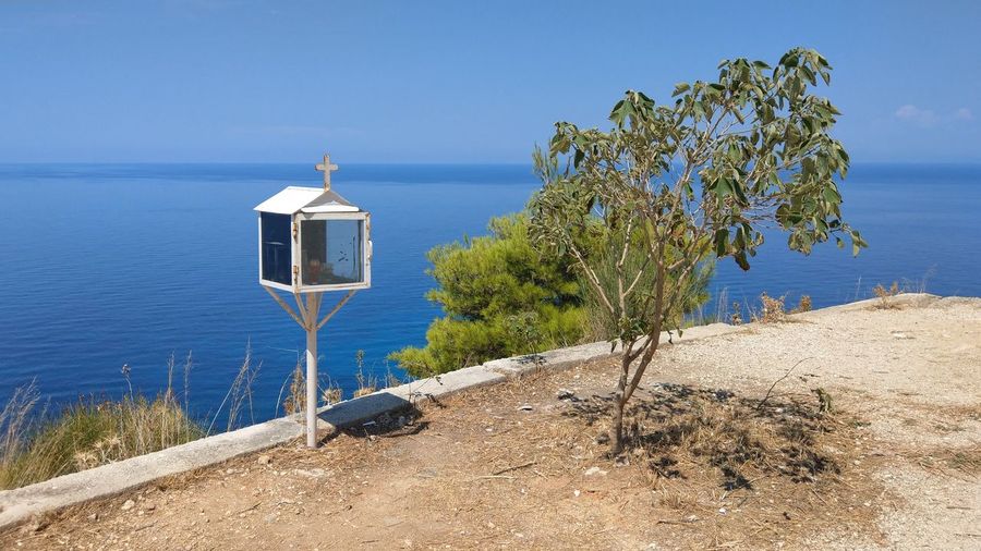 Lifeguard hut on beach against sky
