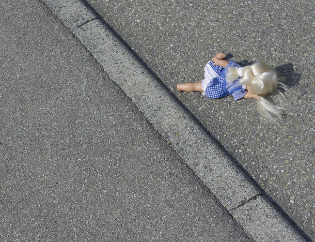 High angle view of doll on street