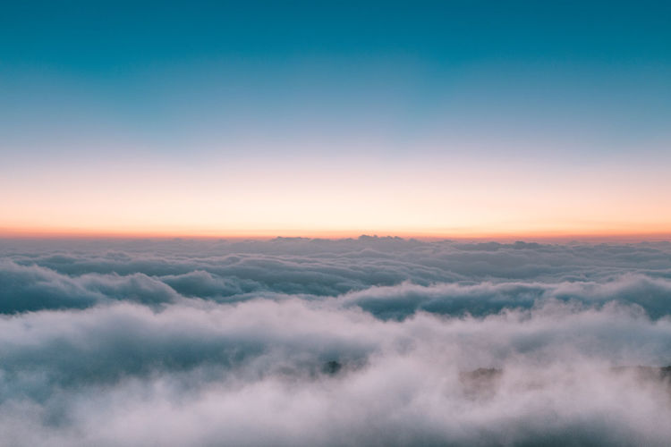 Aerial view of landscape against sky at sunset
