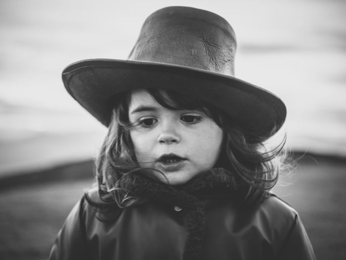 Close-up portrait of a boy wearing hat