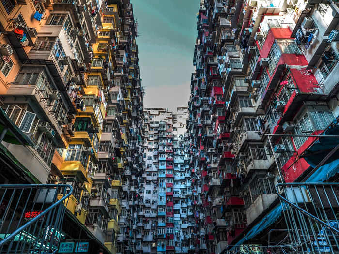Low angle view of buildings against sky in city