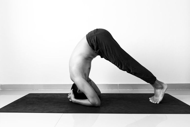 Black and white yoga exercise stretching meditation.