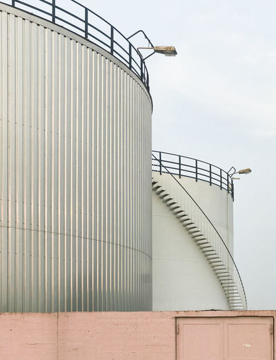 Storage tank against sky
