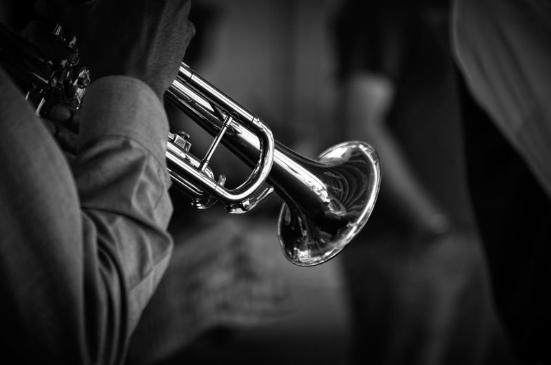 Cropped hand playing trumpet