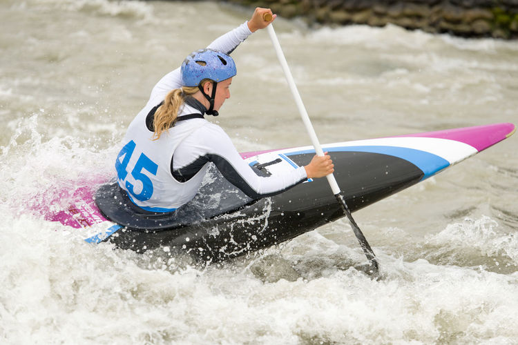 Woman kayaking at river