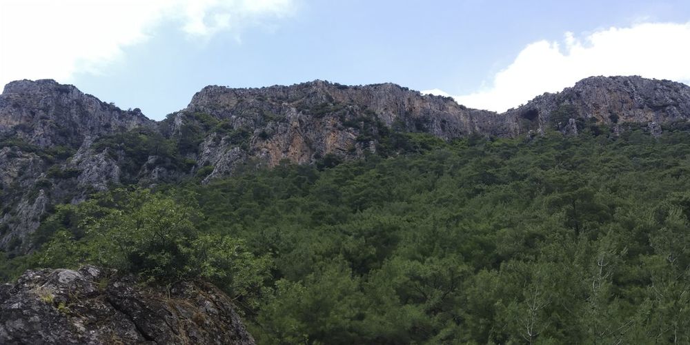 Scenic view of rocky mountains against sky