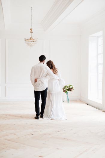 Young couple standing at home