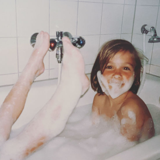 Portrait of baby boy in bathroom