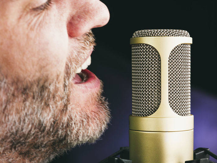 Close-up of man singing