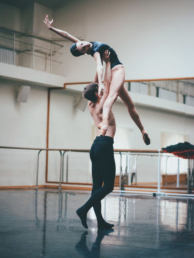 Architecture Arts Culture And Entertainment Balance Ballet Ballet Dancer Ballet Studio Dancer Day Dedication Exercising Expertise Flexibility Full Length Grace Indoors Performance Performing Arts Event Practicing Real People Skill Standing Strength Two People Young Adult Young Women