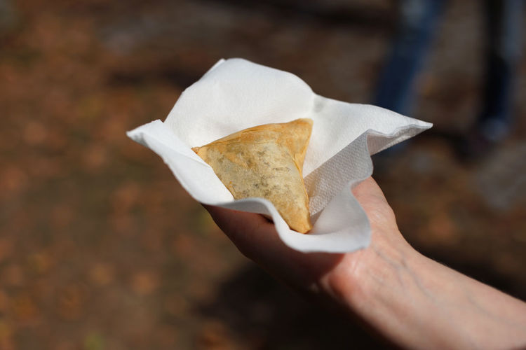 Vegan samosa in white napkin