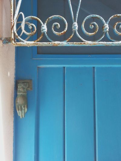 Low angle view of blue door of building