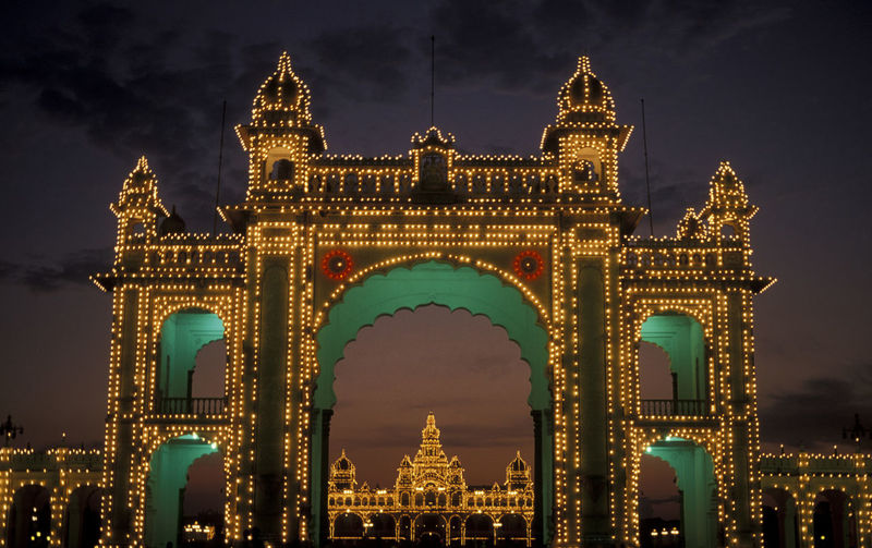 Illuminated entrance gate of mysore palace at night