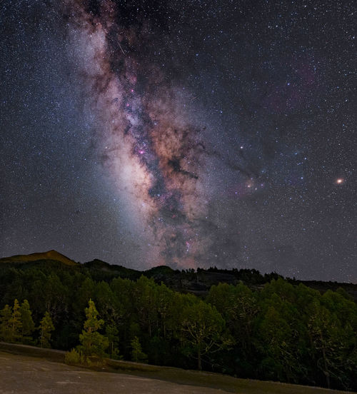 Scenic view of star field against sky at night