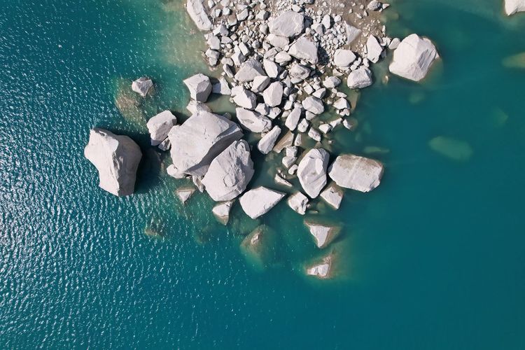 High angle view of rocks in lake 