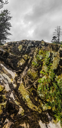 Low angle view of rocks against sky