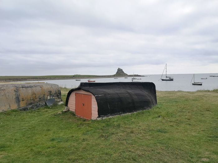 Fishermans hut constructed from an inverted boat. lindisfarne northumbria uk