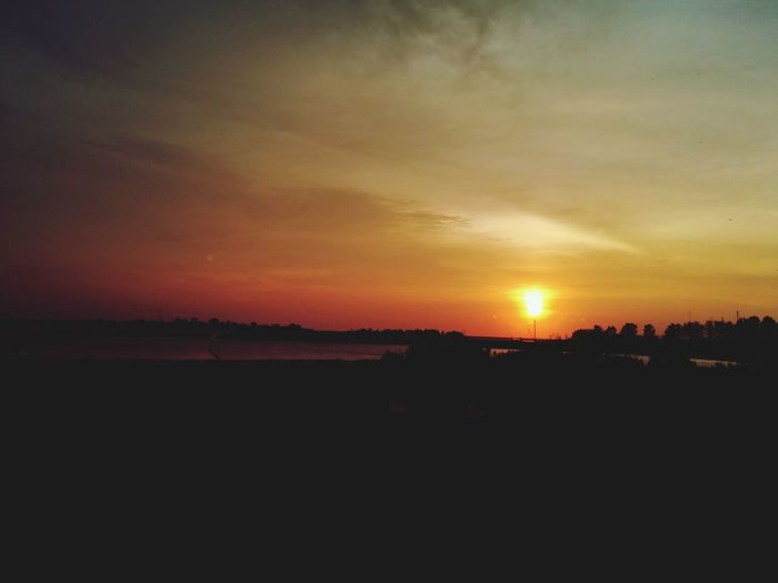 Scenic view of landscape at sunset