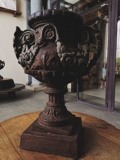 Close-up of sculpture on table in building