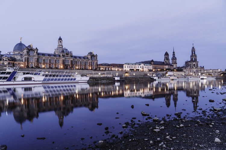 Skyline of dresden, germany with reflection in the water. long exposure. sunrise. blue hour. 