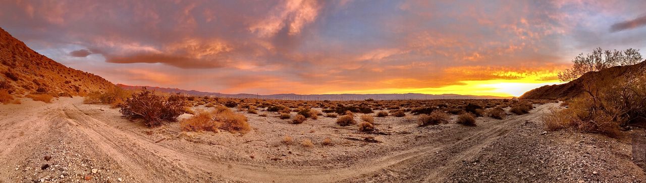 Scenic view of desert against sky during sunset