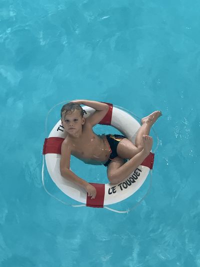 High angle view of boy in swimming pool