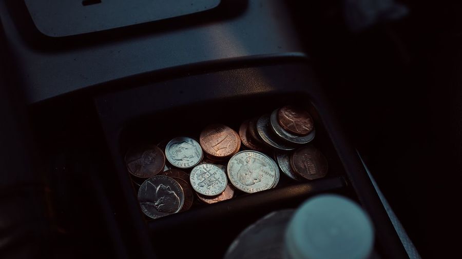 High angle view of coins on table