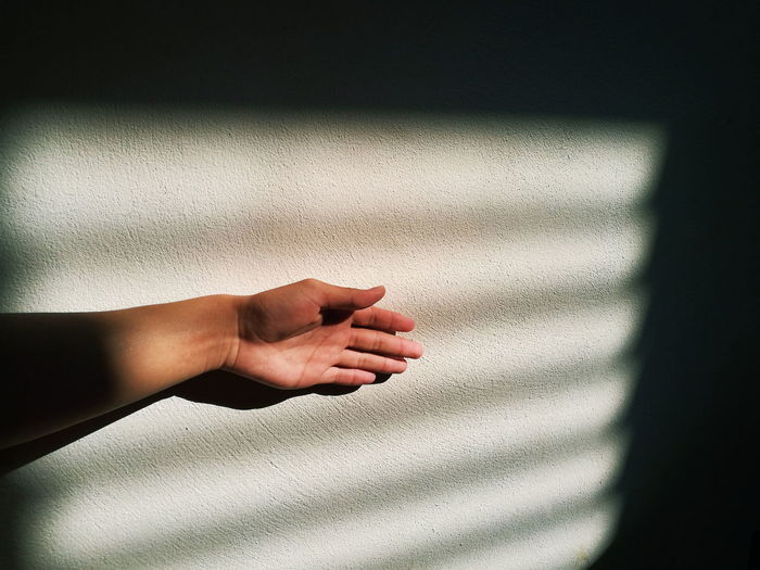Close-up of hand with shadow
