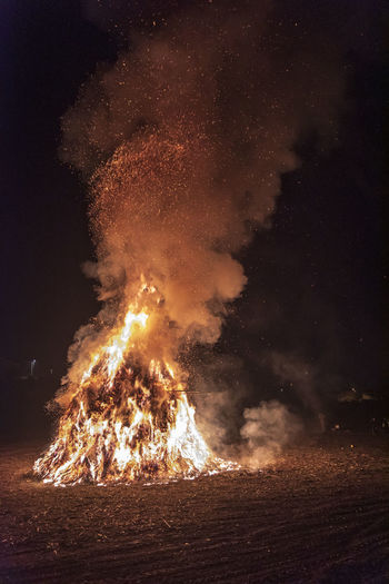 Ancient tradition of epiphany fires in friuli. pignarul and fireworks.