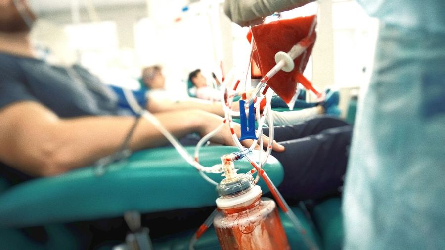 People donating blood at hospital