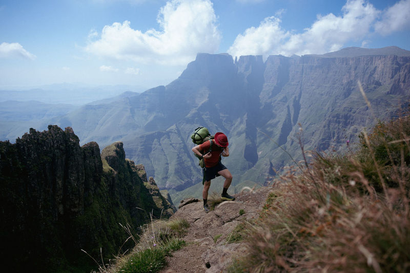 Rear view of man walking on mountain