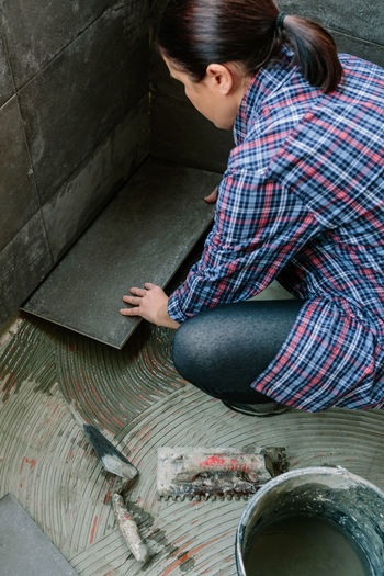 High angle view of woman working at construction site