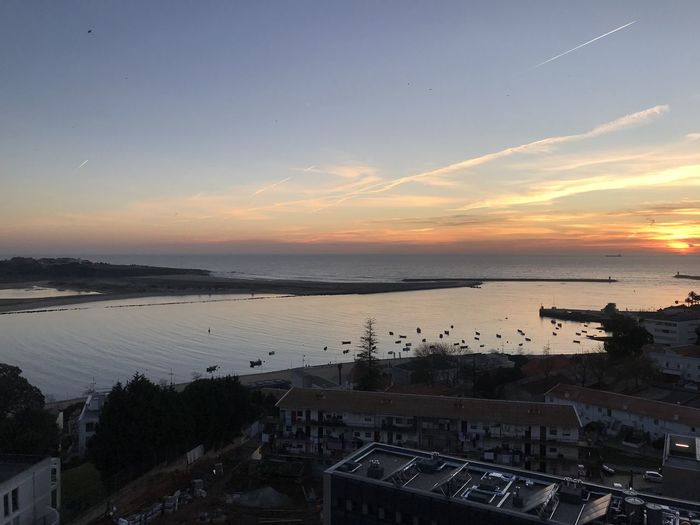 High angle view of sea against sky during sunset