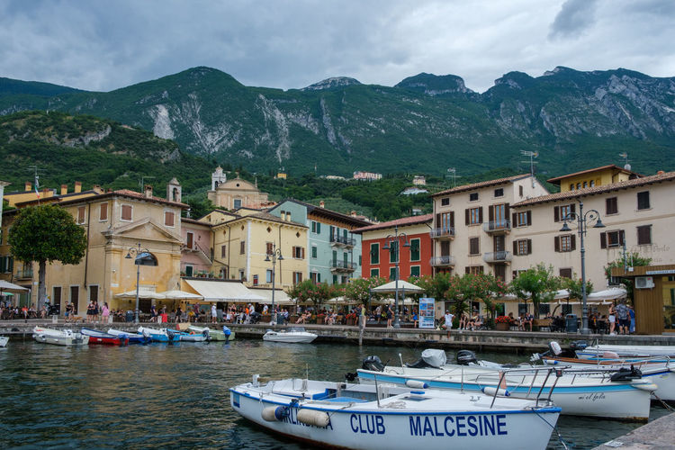 View of townscape by mountains against sky