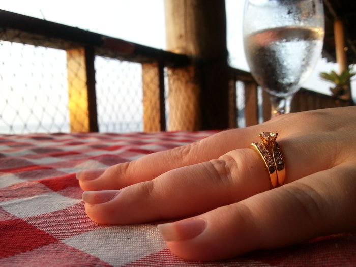 Close-up of woman hand on table