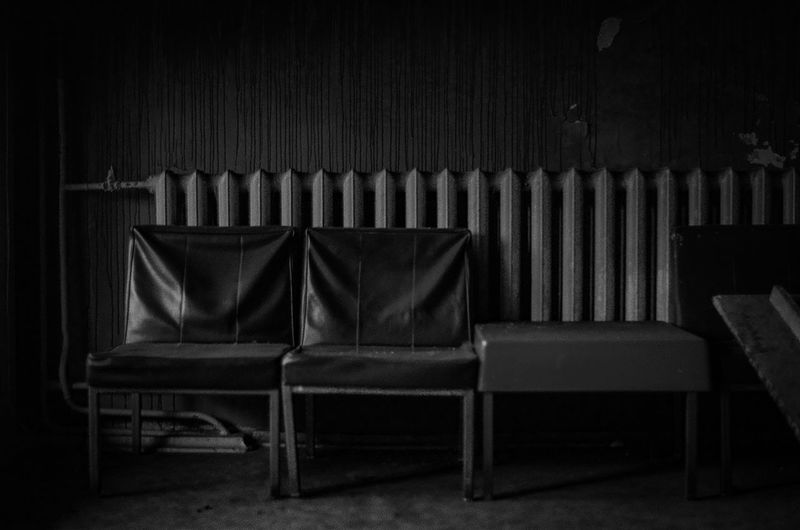 Empty chairs and tables in the dark room