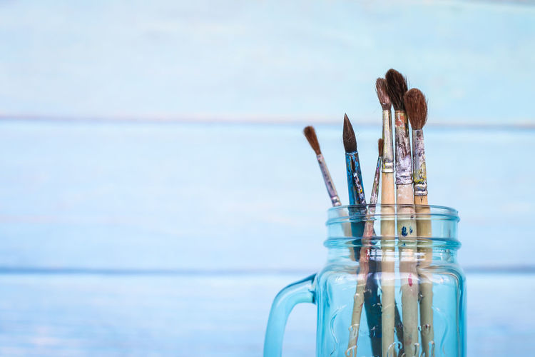 Close-up of paintbrushes in jar
