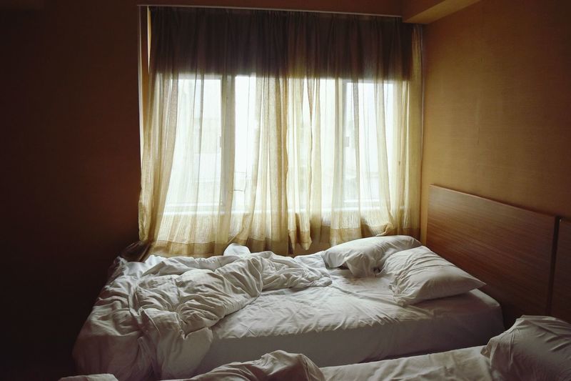 High angle view of bed by window