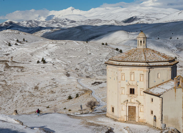 Oratory of santa maria della pietà in calascio in abruzzo, italian snowy winter landscape