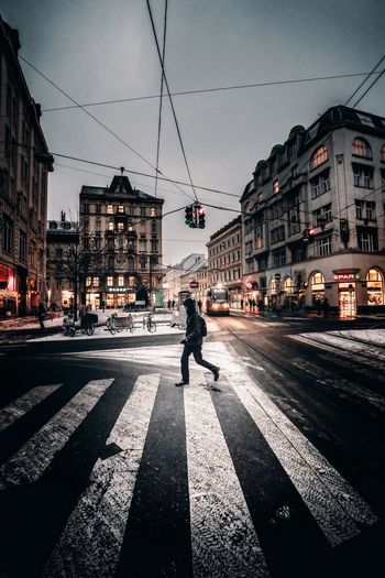 Full length of man walking on city street