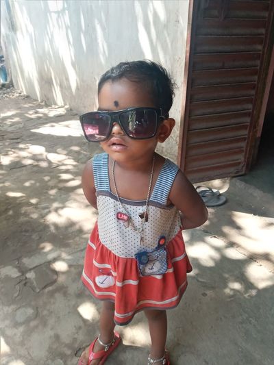 Portrait of boy standing in sunglasses