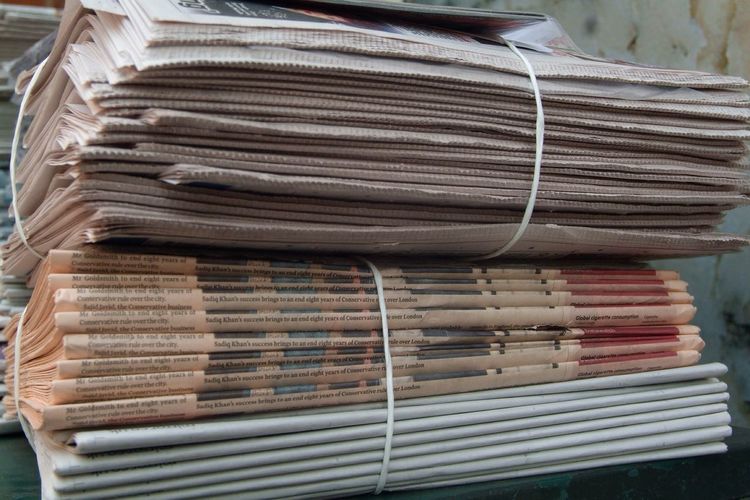 Close-up of newspaper bundles