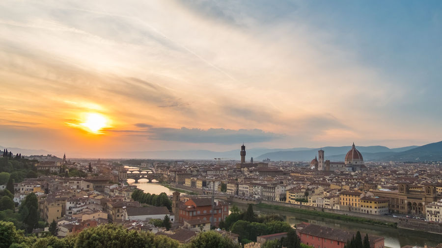 Cityscape against sky during sunset