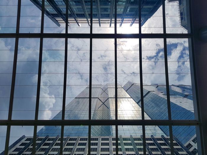 Reflection of buildings on glass window
