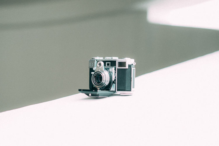 Close-up of camera on table