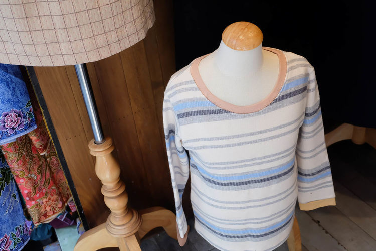 High angle view of sweater on mannequin in store