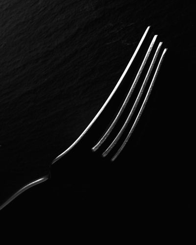 High angle view of fork on table